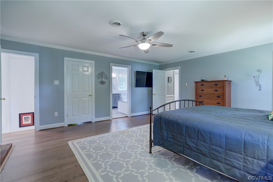 2615 Radstock Road Midlothian, VA 23113 - Photo 32 of 42 a bedroom with a bed and a chandelier