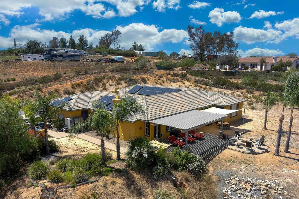 22963 Stokes Road Ramona, CA 92065 - Photo 49 of 57 a view of a houses with a yard
