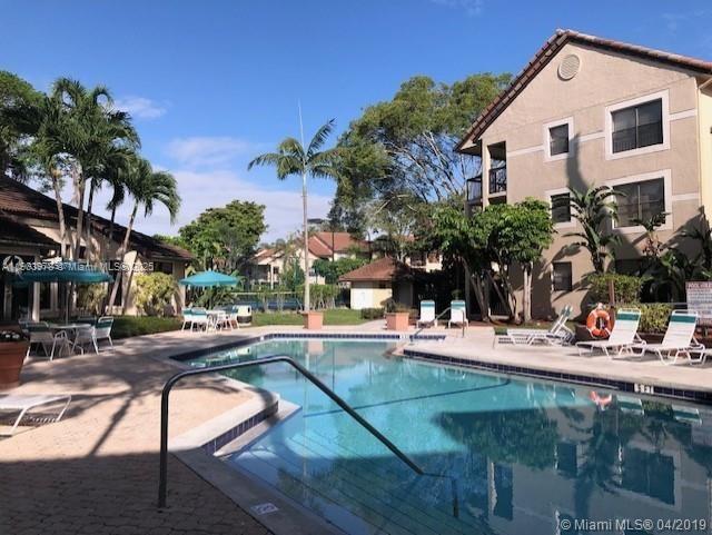 4541 West McNab Road, Unit 16 Pompano Beach, FL 33069 - Photo 22 of 23 a view of a house with backyard and sitting area