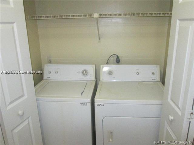 4541 West McNab Road, Unit 16 Pompano Beach, FL 33069 - Photo 5 of 23 a utility room with dryer and washer