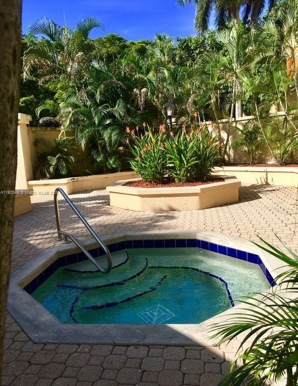 4541 West McNab Road, Unit 16 Pompano Beach, FL 33069 - Photo 7 of 23 a view of swimming pool with a yard