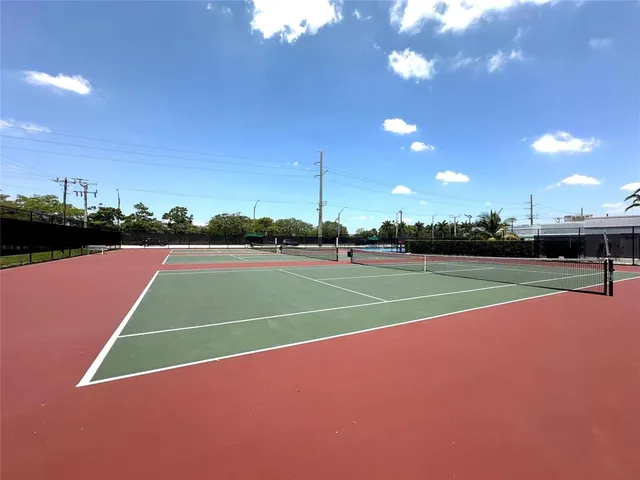 a view of living room with furniture and a large window