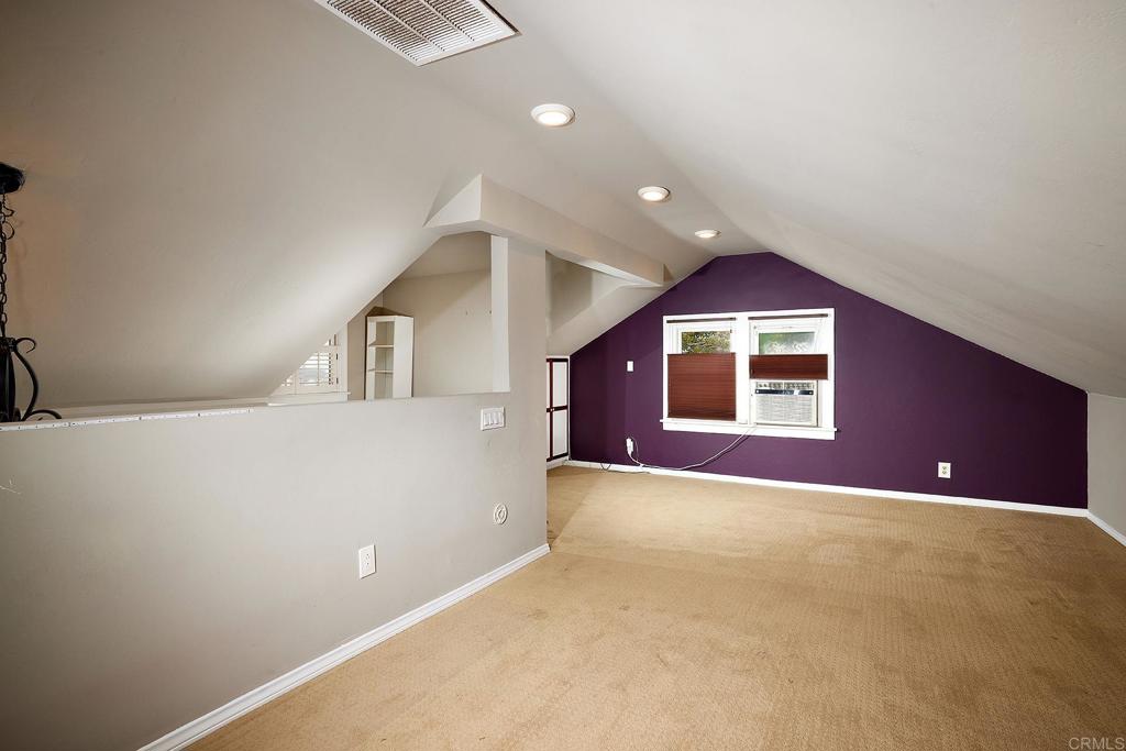 3252 Highland Drive Carlsbad, CA 92008 - Photo 32 of 55 a view of a big room with wooden floor and windows