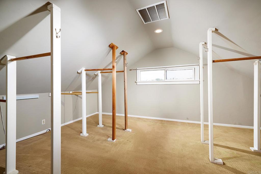3252 Highland Drive Carlsbad, CA 92008 - Photo 35 of 55 a view of a room with wooden floor and white walls
