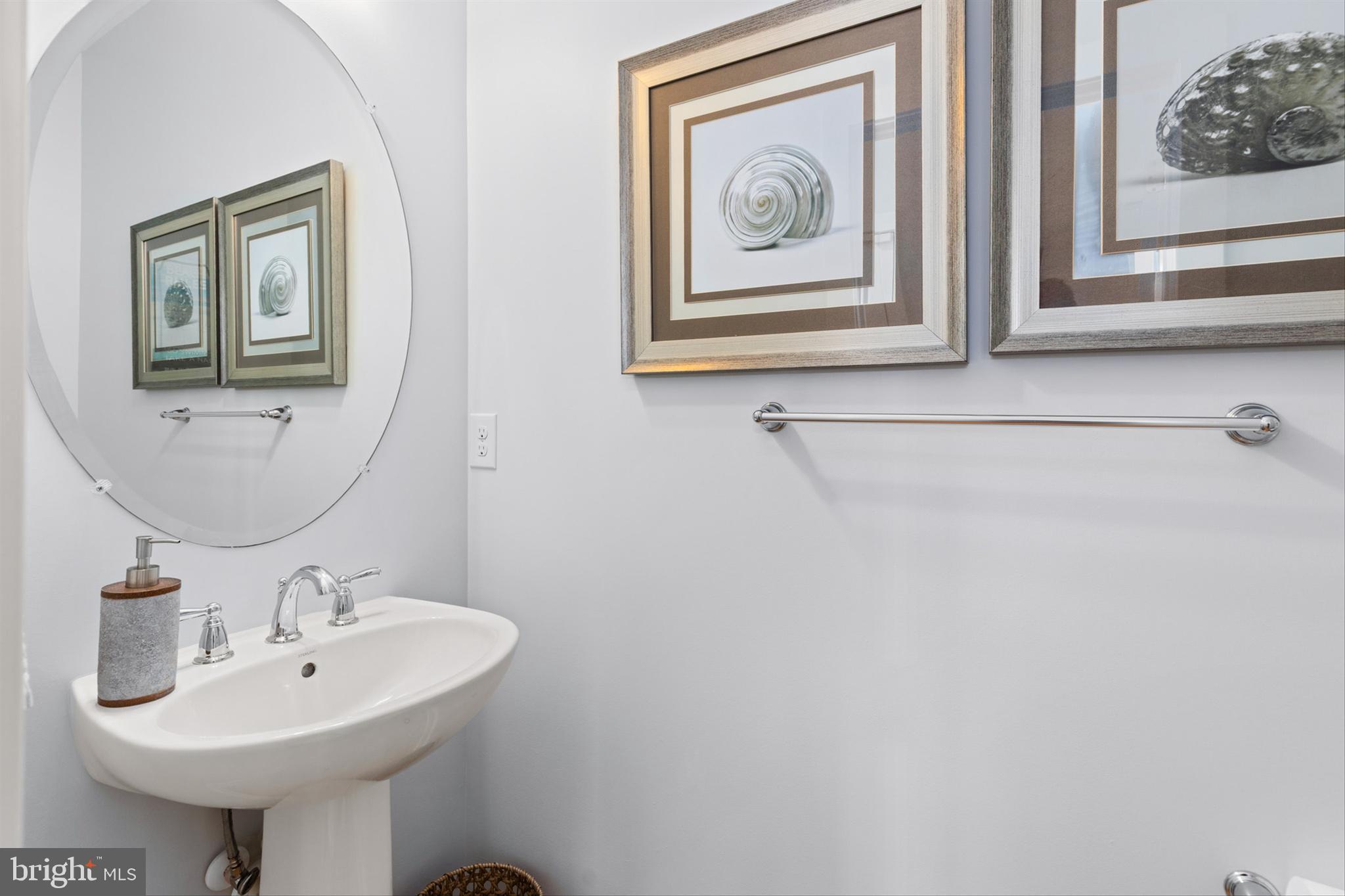 2 Smithfield Court, Unit 111 Ocean View, DE 19970 - Photo 14 of 32 a bathroom with a sink and a mirror