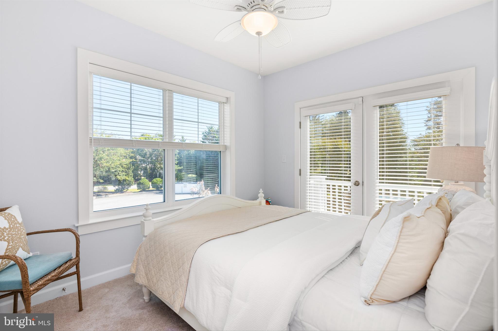 2 Smithfield Court, Unit 111 Ocean View, DE 19970 - Photo 23 of 32 a bedroom with a bed and a large window