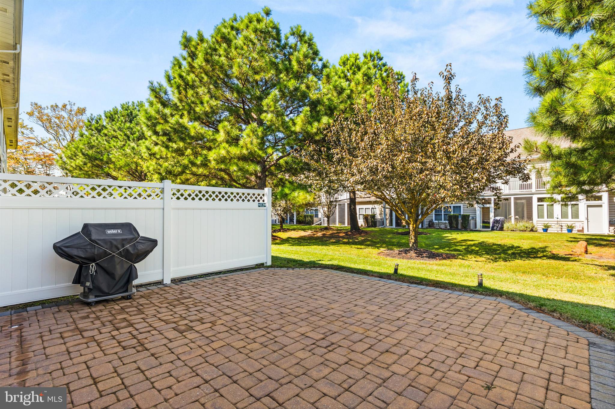 2 Smithfield Court, Unit 111 Ocean View, DE 19970 - Photo 31 of 32 a view of swimming pool with outdoor seating and yard