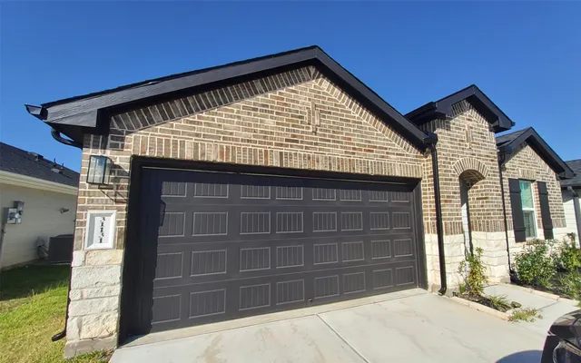 a front view of a house with a garage