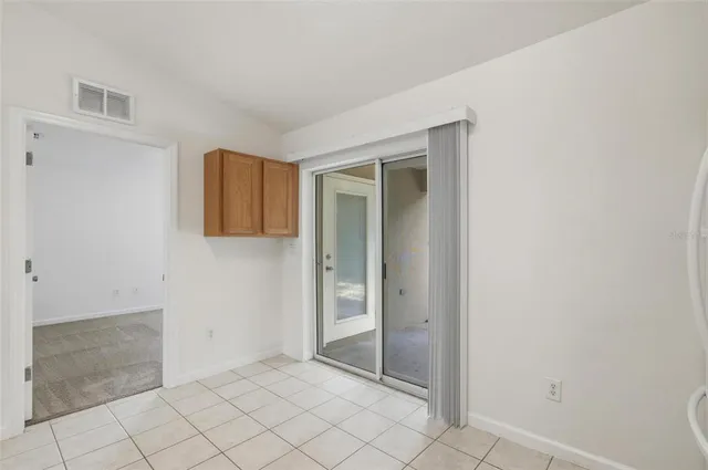 a bathroom with a granite countertop sink a mirror and a shower