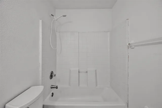 a bathroom with a sink and shower