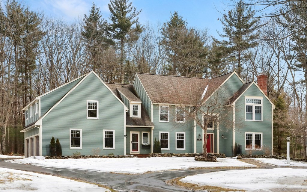 9 Powder House Lane Boxford, MA 01921 - Photo 1 of 42 a front view of a house with a yard and garage