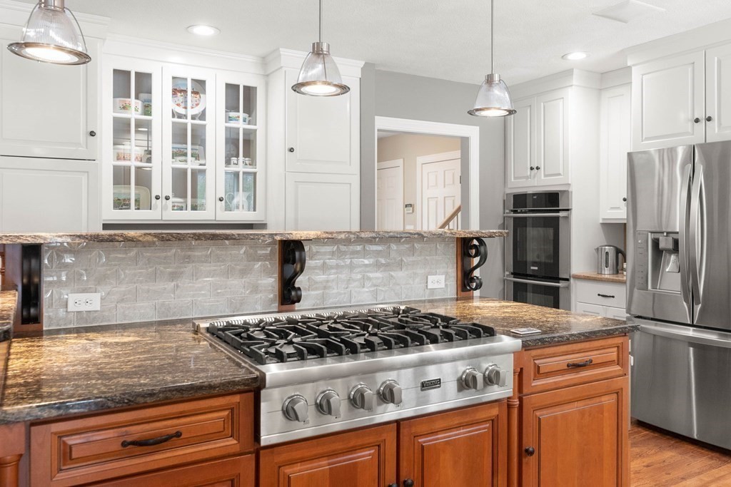 9 Powder House Lane Boxford, MA 01921 - Photo 13 of 42 a kitchen with stainless steel appliances granite countertop a stove and a refrigerator