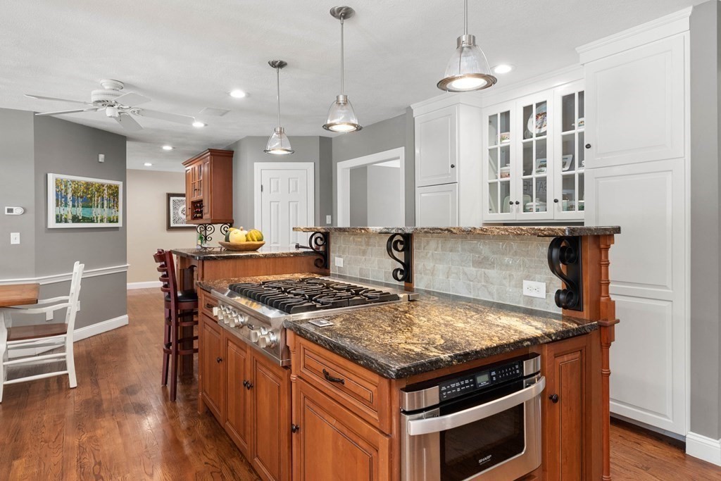 9 Powder House Lane Boxford, MA 01921 - Photo 14 of 42 a kitchen with a stove and a wooden floor