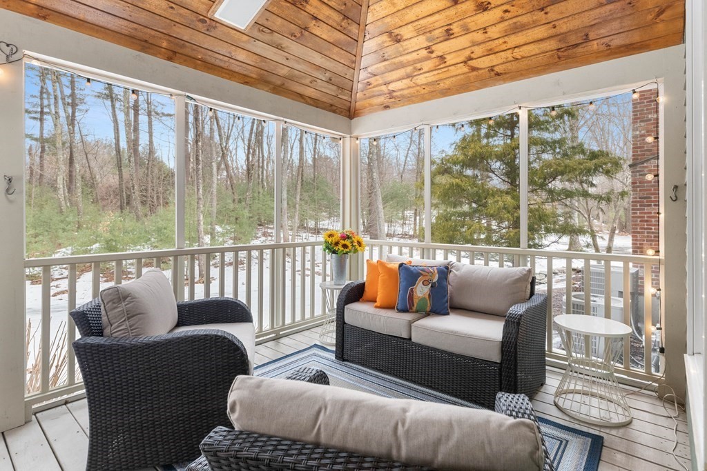 9 Powder House Lane Boxford, MA 01921 - Photo 19 of 42 a balcony with furniture and a floor to ceiling window