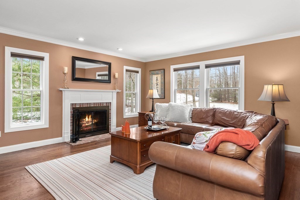 9 Powder House Lane Boxford, MA 01921 - Photo 2 of 42 a living room with furniture and a fireplace