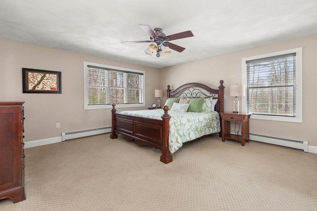 9 Powder House Lane Boxford, MA 01921 - Photo 23 of 42 a bedroom with a bed and a window