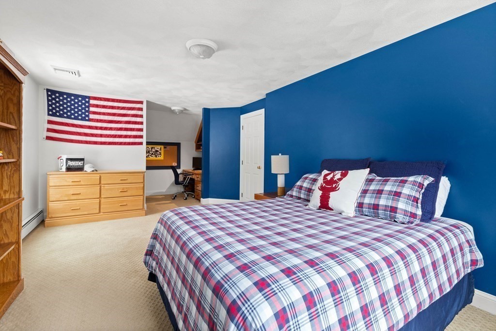 9 Powder House Lane Boxford, MA 01921 - Photo 30 of 42 a bedroom with a bed and a dresser