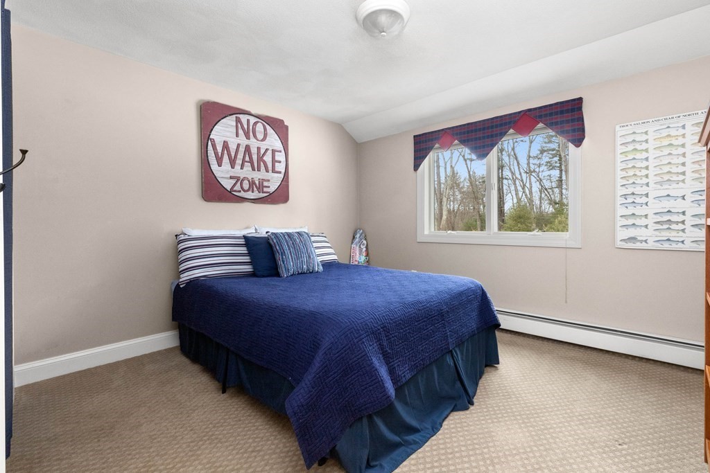 9 Powder House Lane Boxford, MA 01921 - Photo 34 of 42 a bedroom with a bed and a window