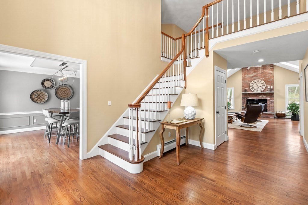 9 Powder House Lane Boxford, MA 01921 - Photo 4 of 42 a view of entryway livingroom and hall with wooden floor