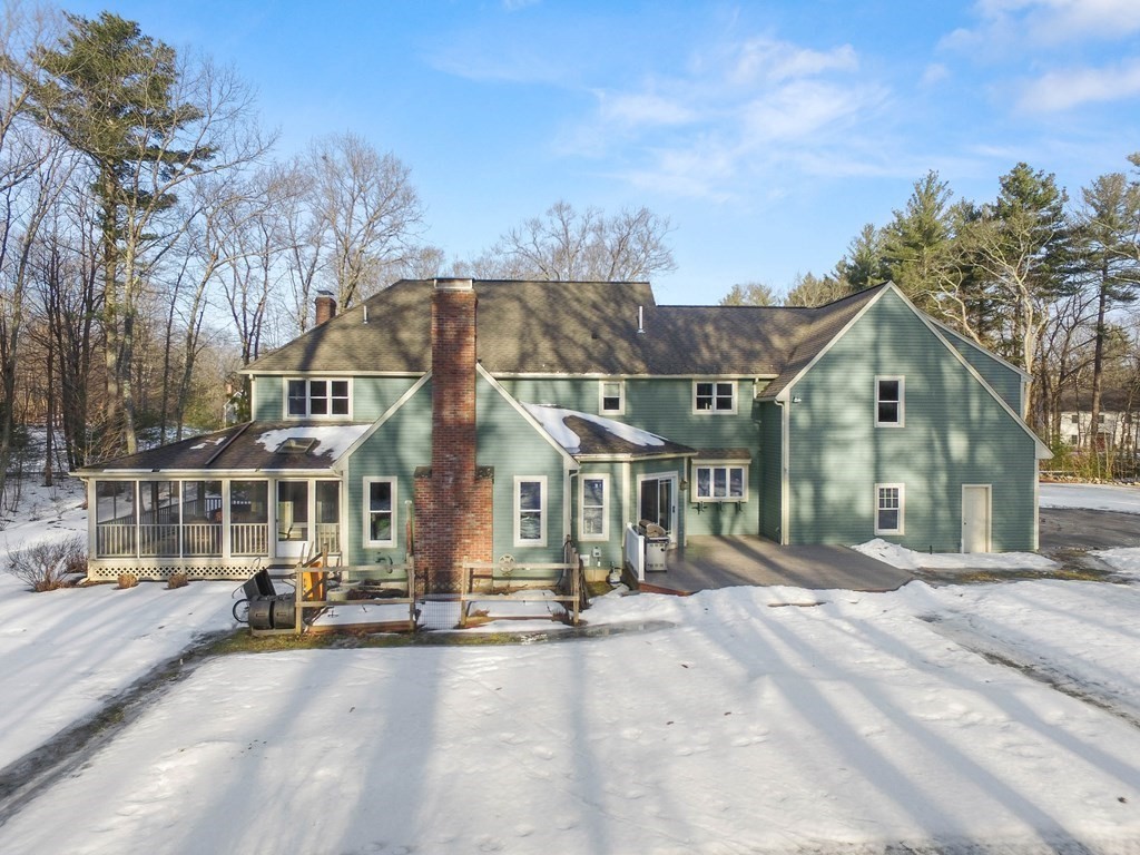 9 Powder House Lane Boxford, MA 01921 - Photo 41 of 42 a front view of a building with a yard