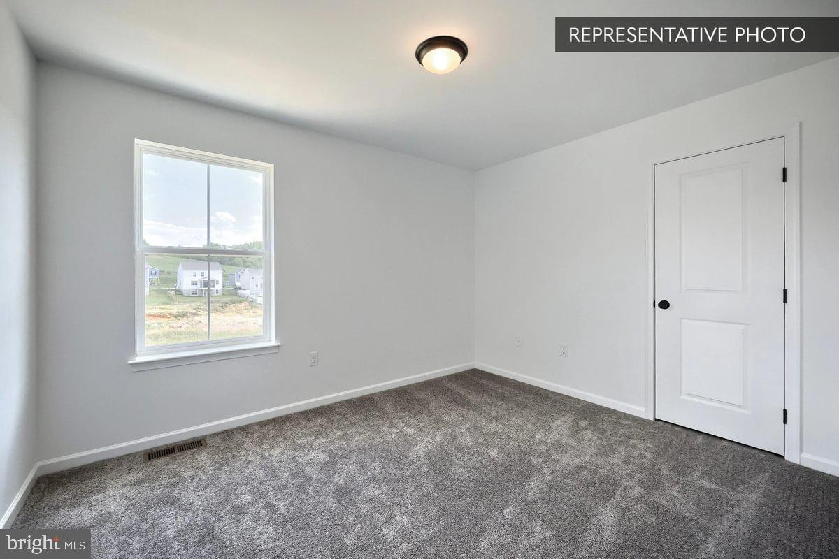 119 Redbud Road Bellefonte, PA 16823 - Photo 8 of 8 an empty room with windows