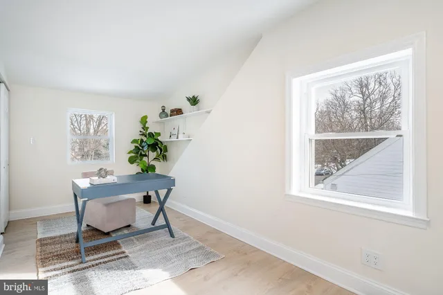 a workspace with furniture and a window