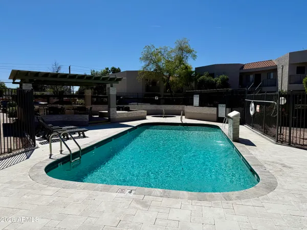 a view of a backyard with sitting area