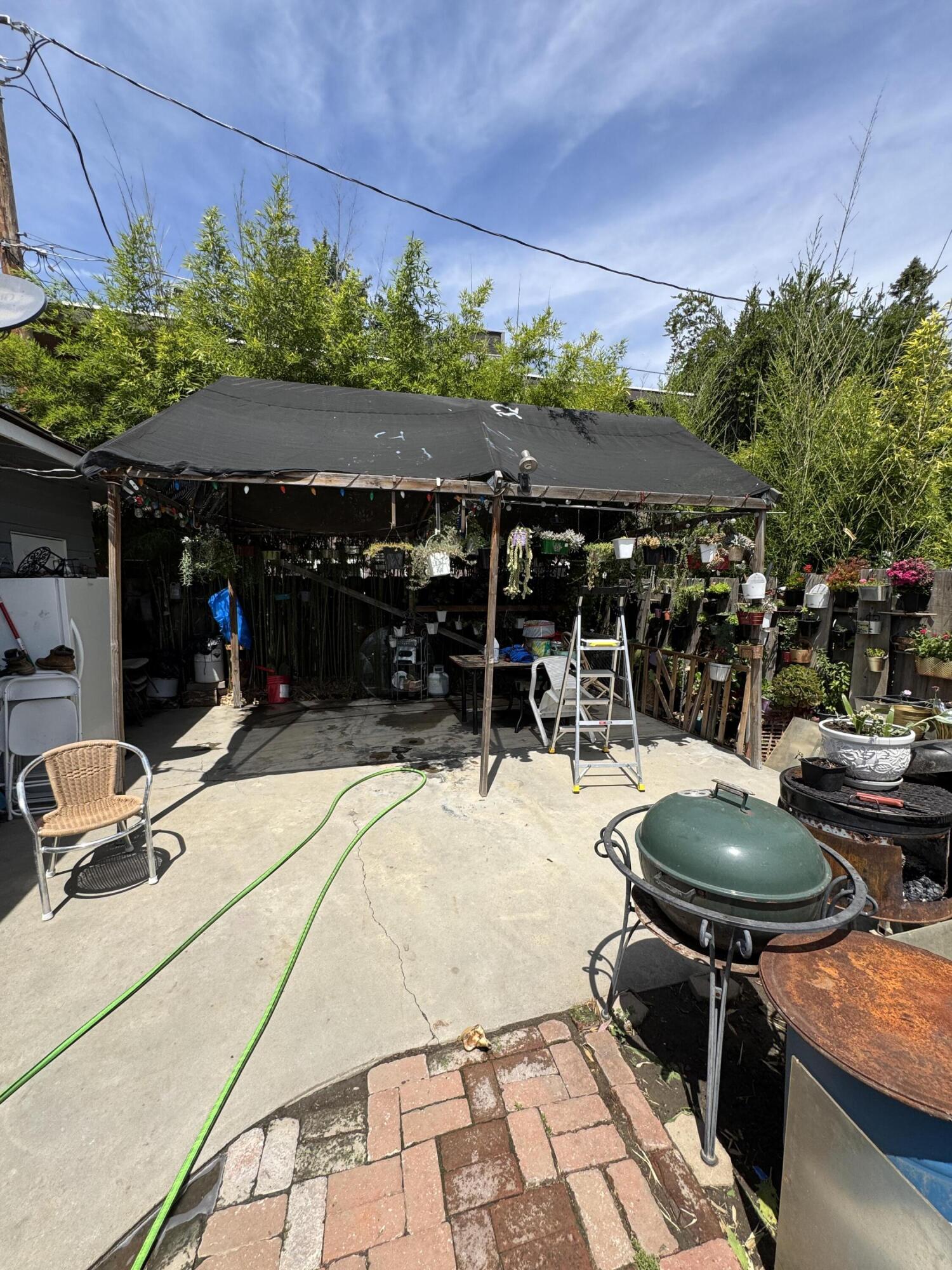 704 North Floral Street Visalia, CA 93291 - Photo 29 of 51 a view of a chairs and tables in patio