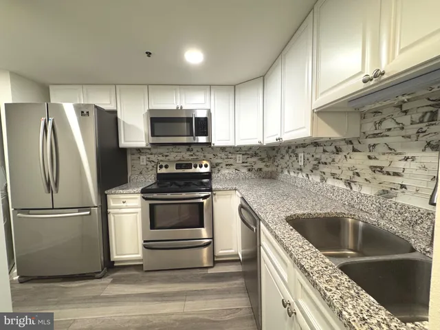 a view of front door with wooden floor