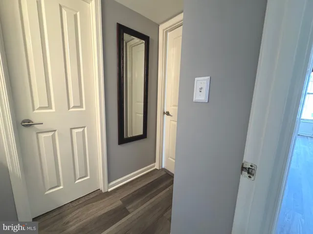 a kitchen with granite countertop a refrigerator and a sink