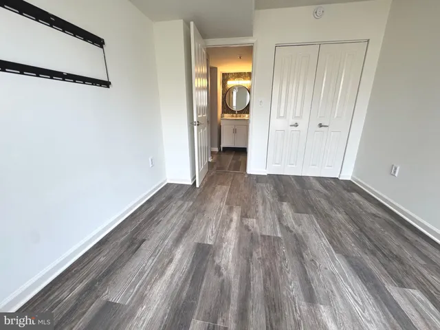 a bedroom with bed and window