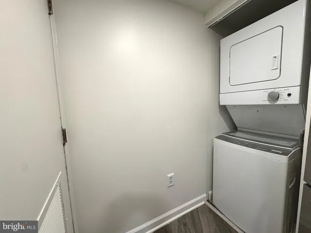 a white toilet sitting next to a bath tub and a shower