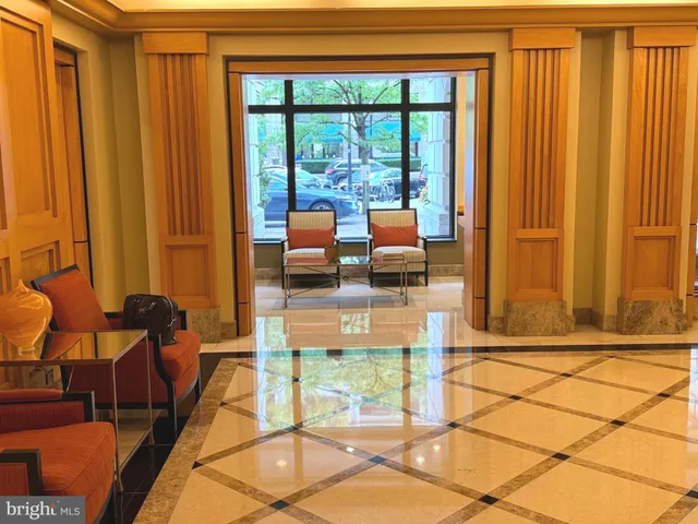 a living room filled with furniture and a table
