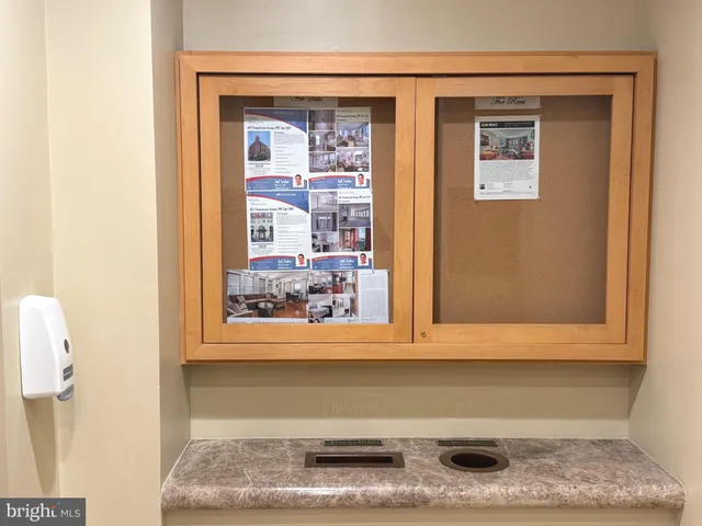 a view of a small space with wooden floor and a window