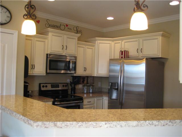 7004 Nickalus Way Spring Hill, TN 37174 - Photo 8 of 18 Lovely Kitchen with Granite Bar Top! Great for entertaining!