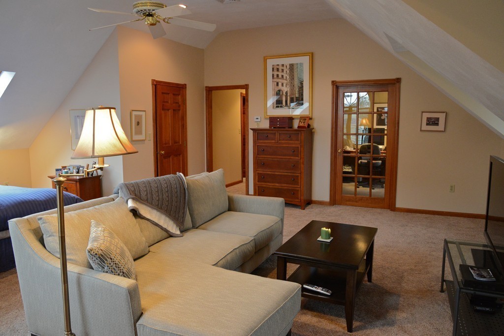 71 Emerson Road Walpole, MA 02032 - Photo 18 of 30 a living room with furniture and a lamp
