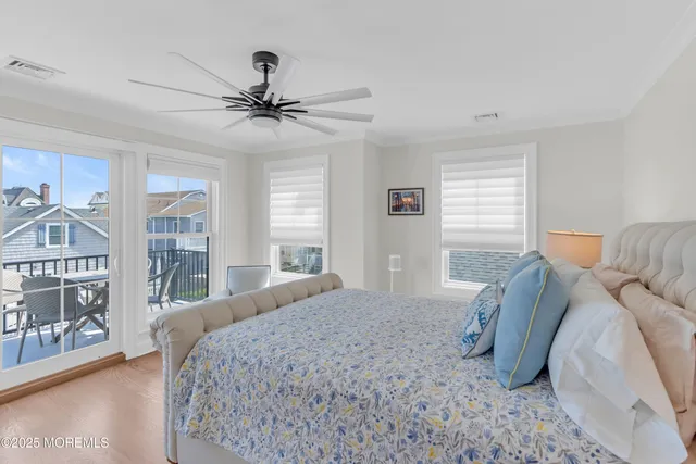 a bedroom with a large bed and a window