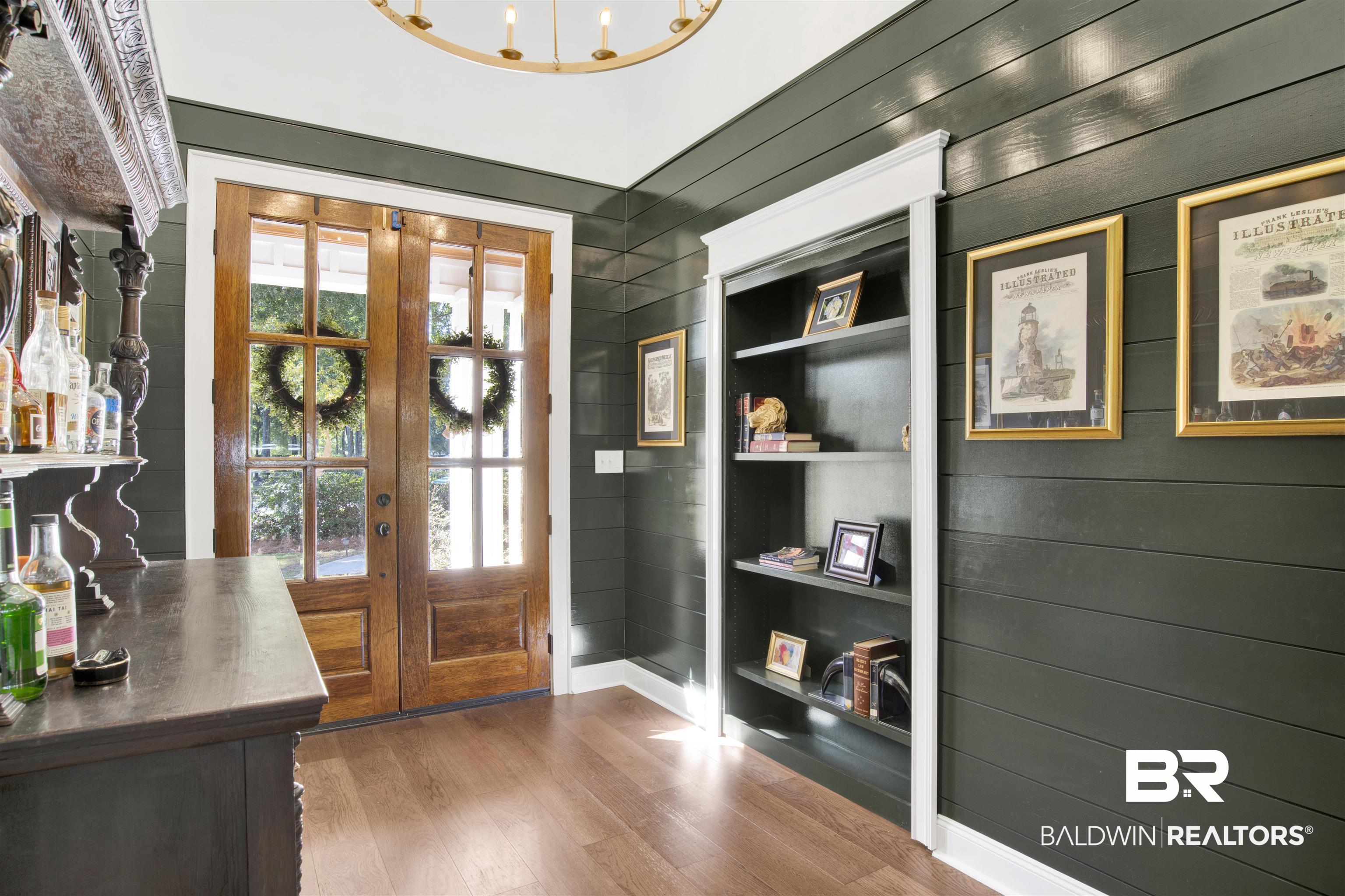 11116 Redfern Road Daphne, AL 36526 - Photo 22 of 46 Entryway with wood walls, wood finished floors, and built in features