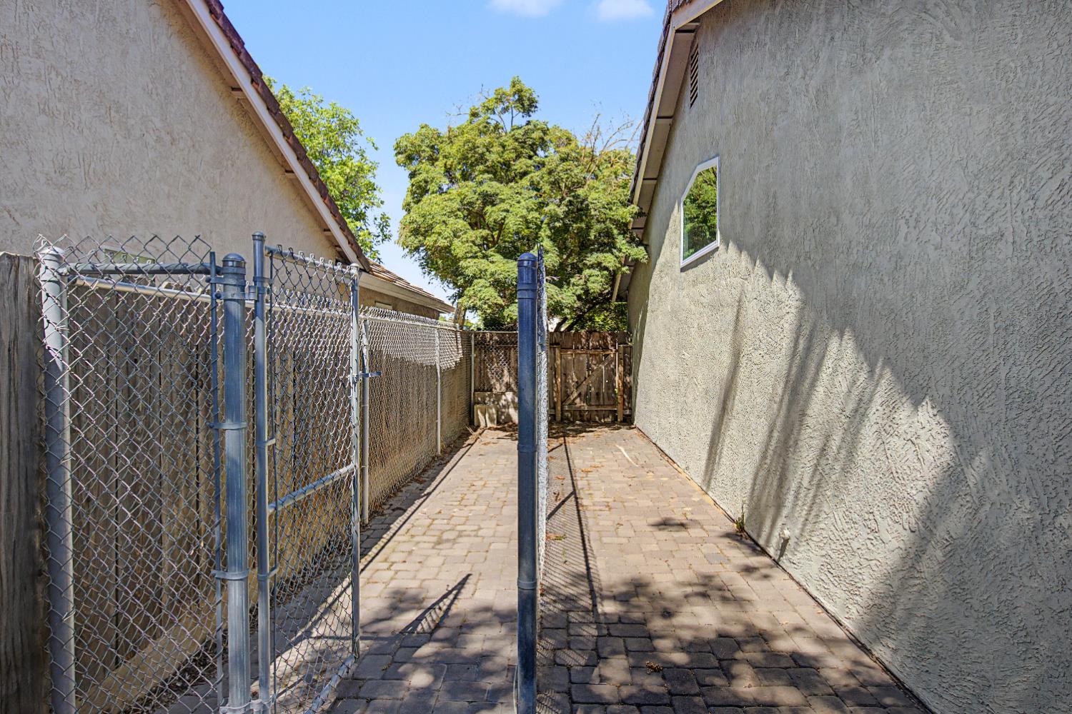 204 Gelf Lane Modesto, CA 95357 - Photo 29 of 29 Dog run/kennel on south side of the home.