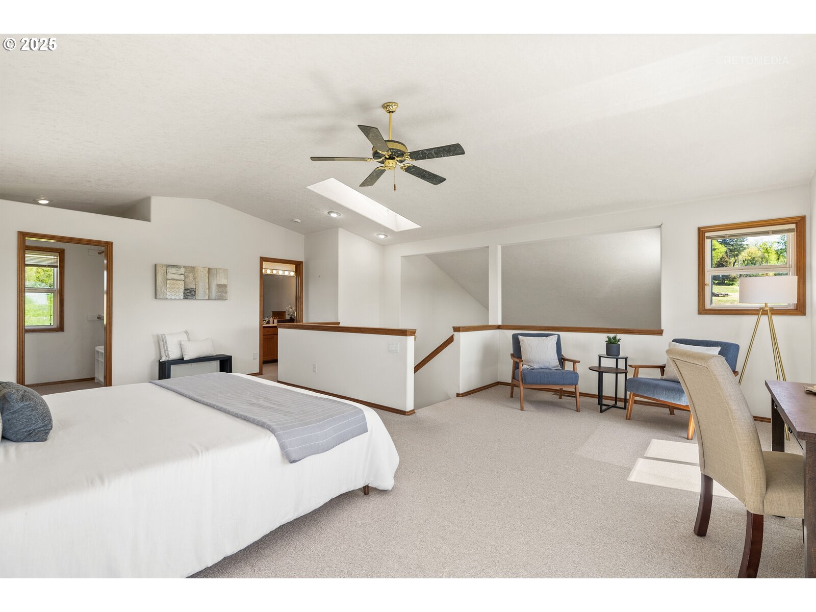 17233 Southeast McKinley Road Gresham, OR 97080 - Photo 23 of 48 a spacious bedroom with a bed and ceiling fan