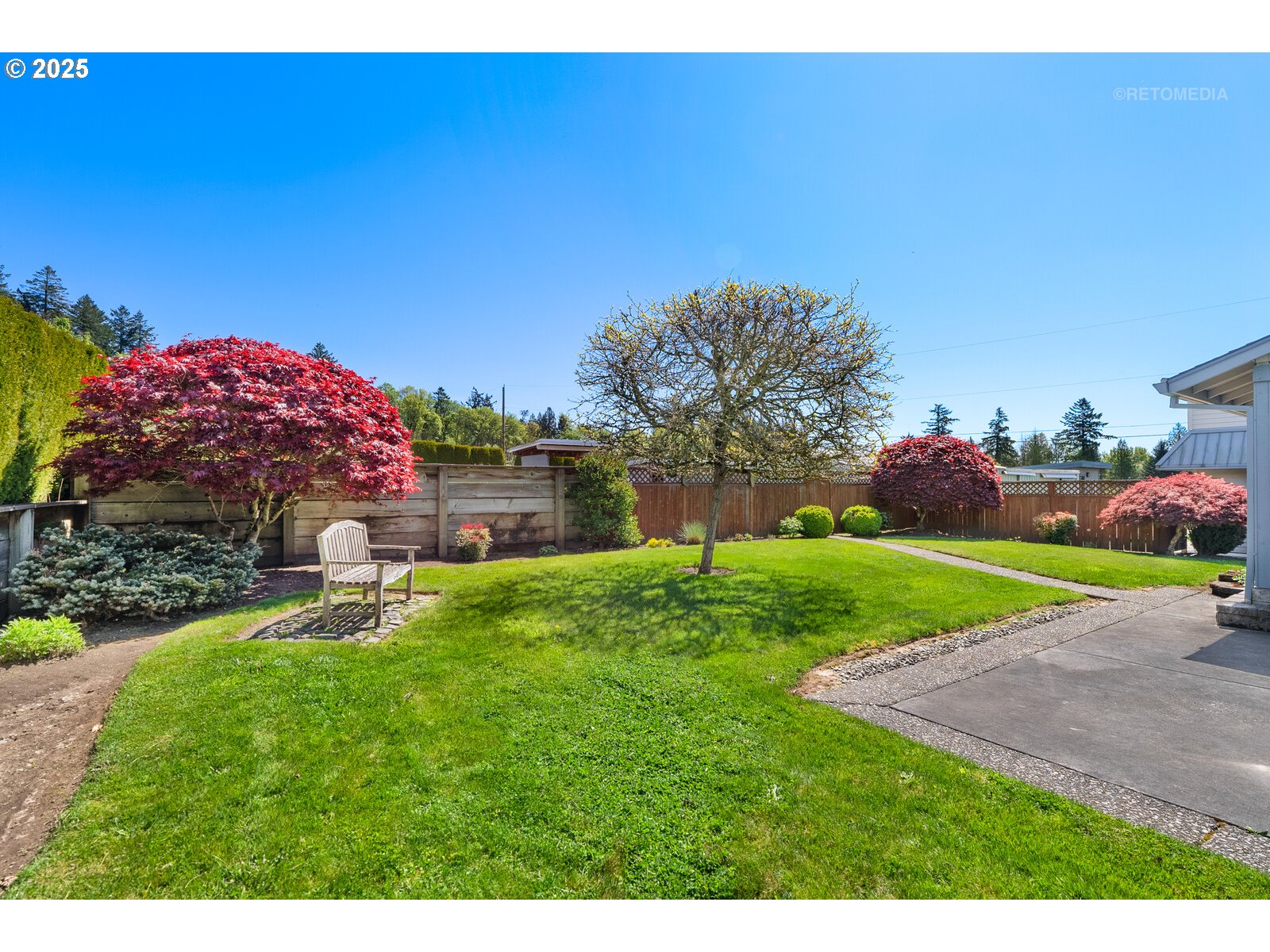 17233 Southeast McKinley Road Gresham, OR 97080 - Photo 42 of 48 a view of a backyard with a garden and entertaining space
