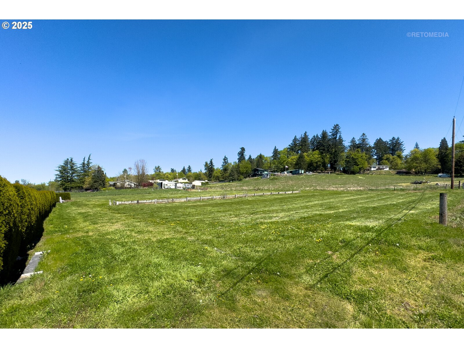 17233 Southeast McKinley Road Gresham, OR 97080 - Photo 46 of 48 a view of a field with trees in the background
