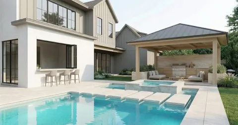 a swimming pool view with a seating space