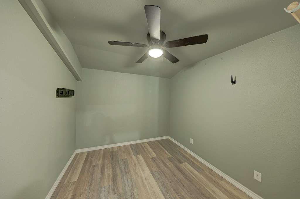 200 Mosel Road Harper, TX 78631 - Photo 18 of 45 a view of a room with wooden floor and fan