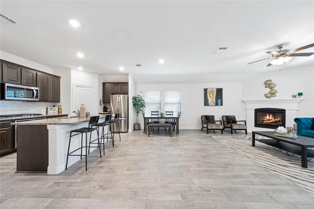 a kitchen with lots of counter top space and appliances