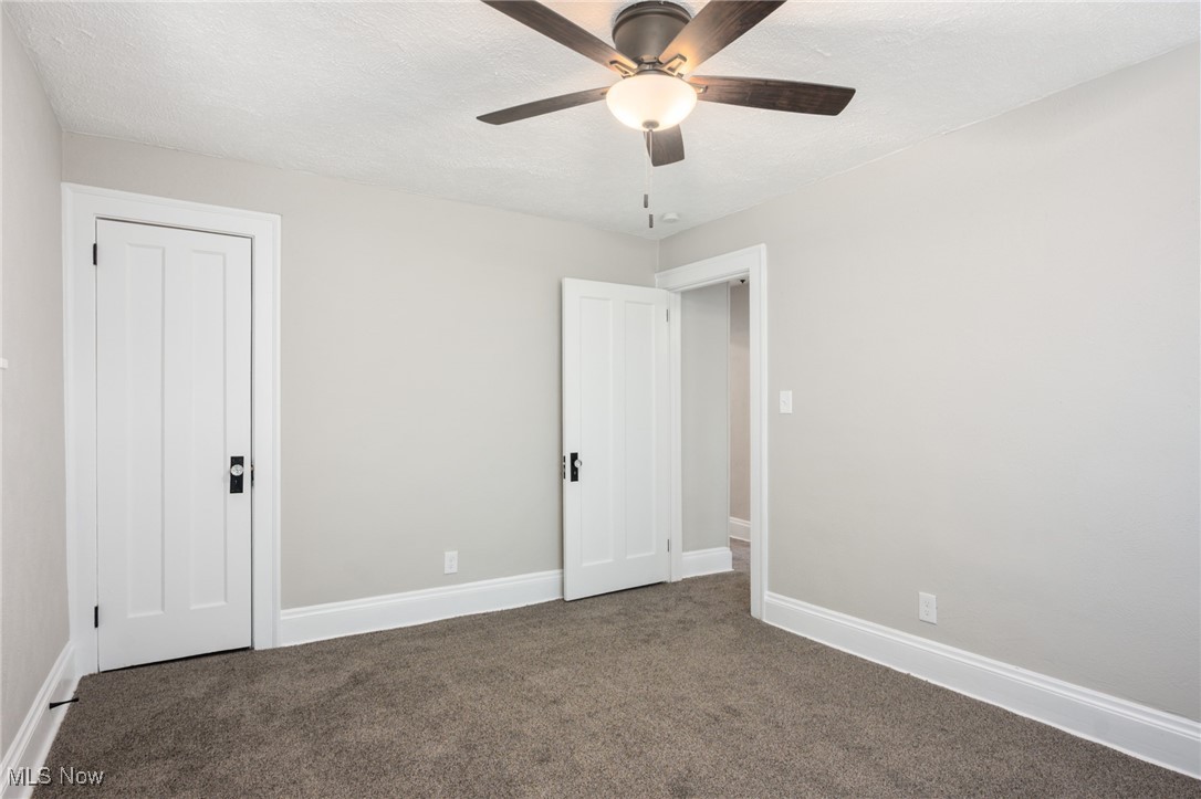 3395 Altamont Road Cleveland, OH 44118 - Photo 17 of 30 Unfurnished bedroom with a textured ceiling, baseboards, and carpet floors