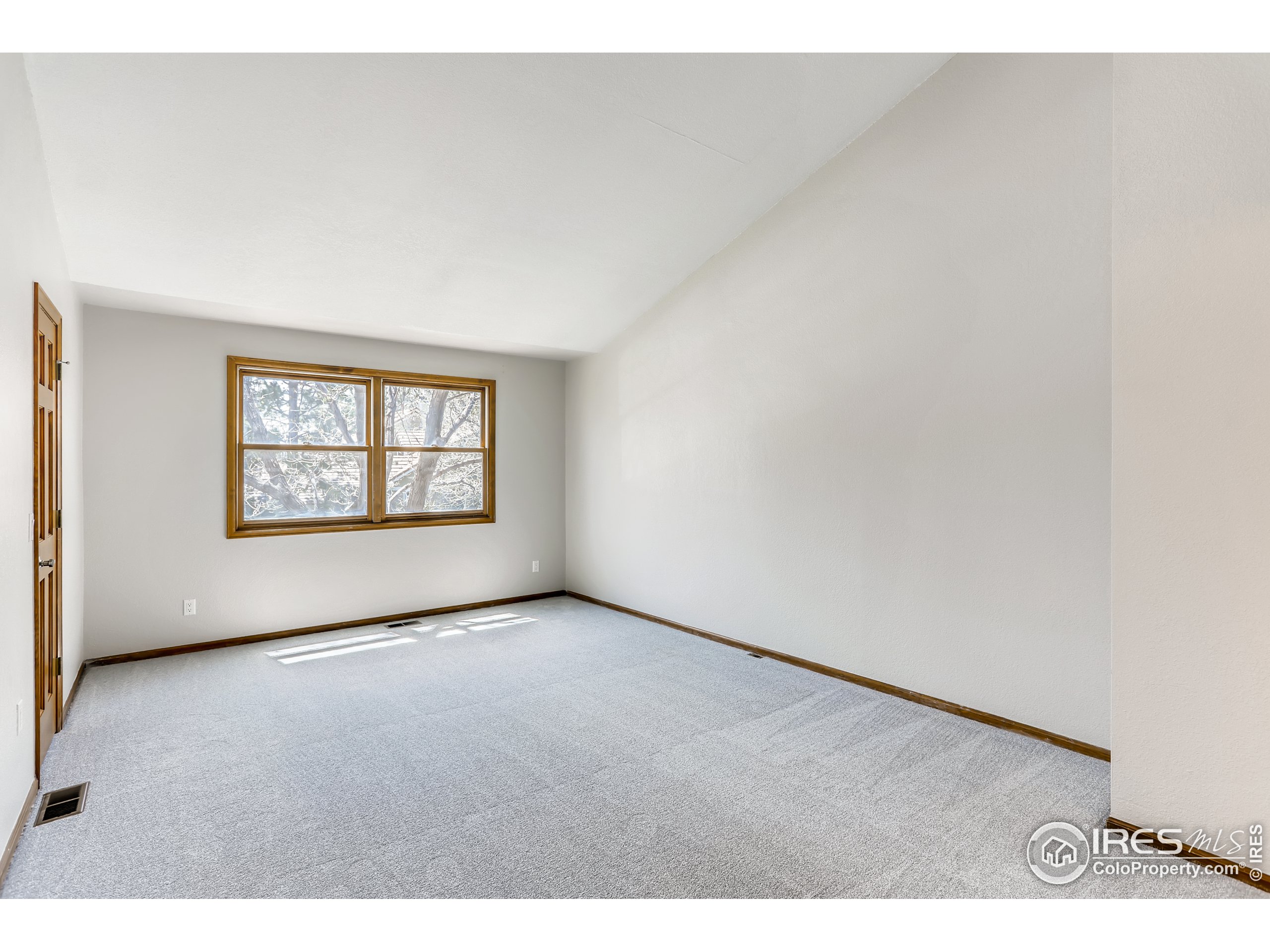 2315 Ranch Drive Westminster, CO 80234 - Photo 11 of 28 a view of an empty room with a window