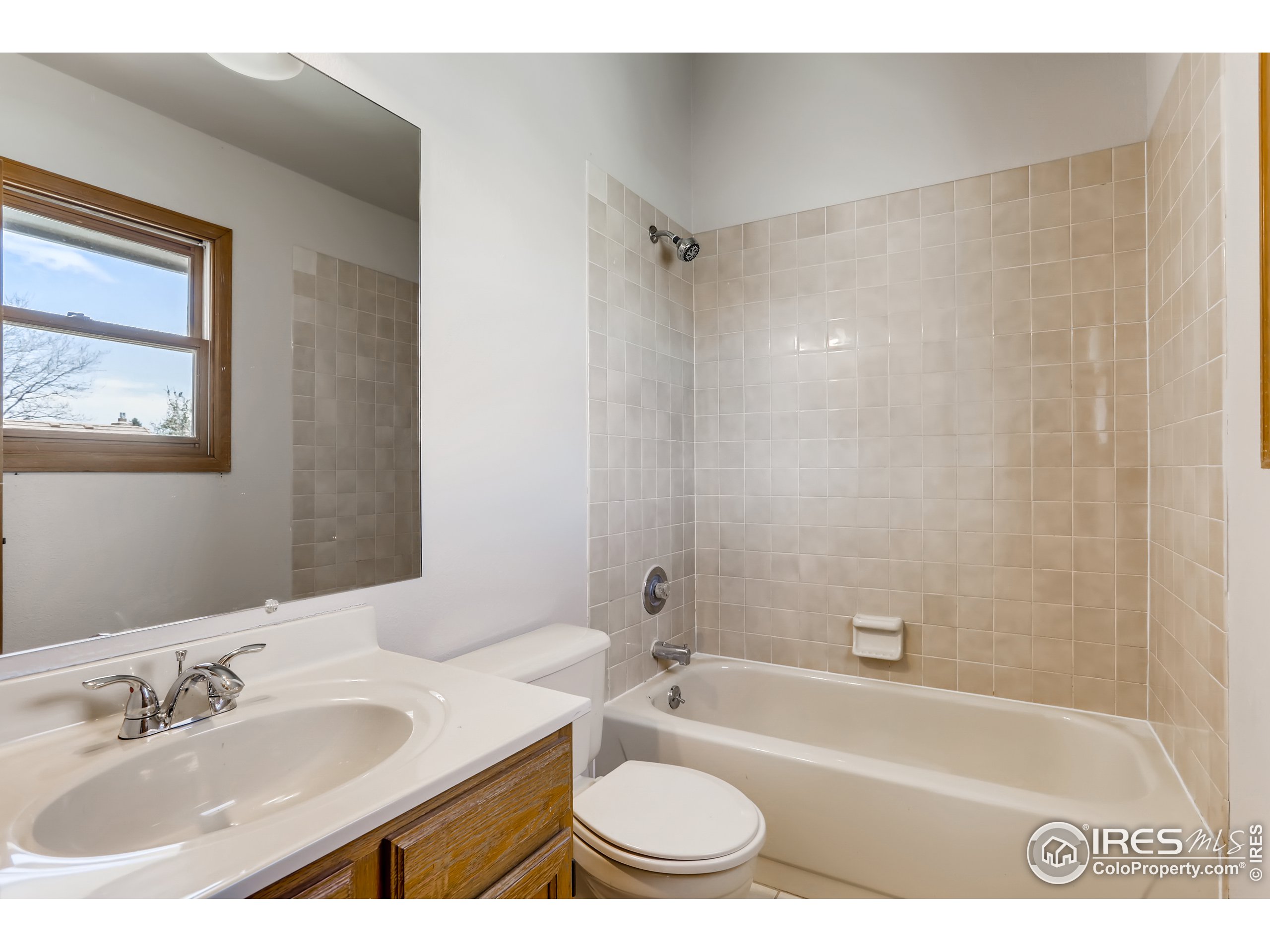 2315 Ranch Drive Westminster, CO 80234 - Photo 16 of 28 a bathroom with a sink and a bathtub