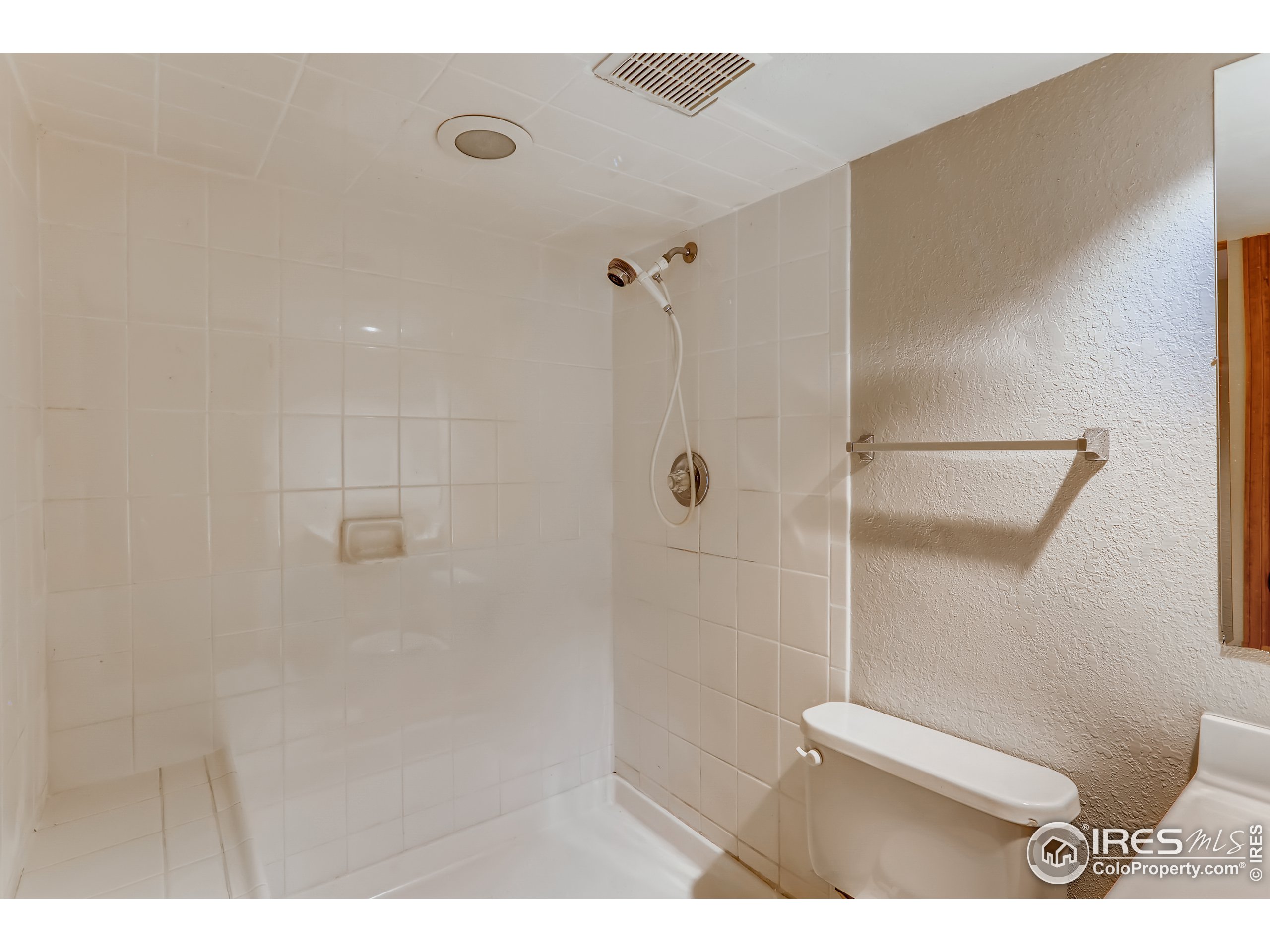 2315 Ranch Drive Westminster, CO 80234 - Photo 20 of 28 a bathroom with a shower