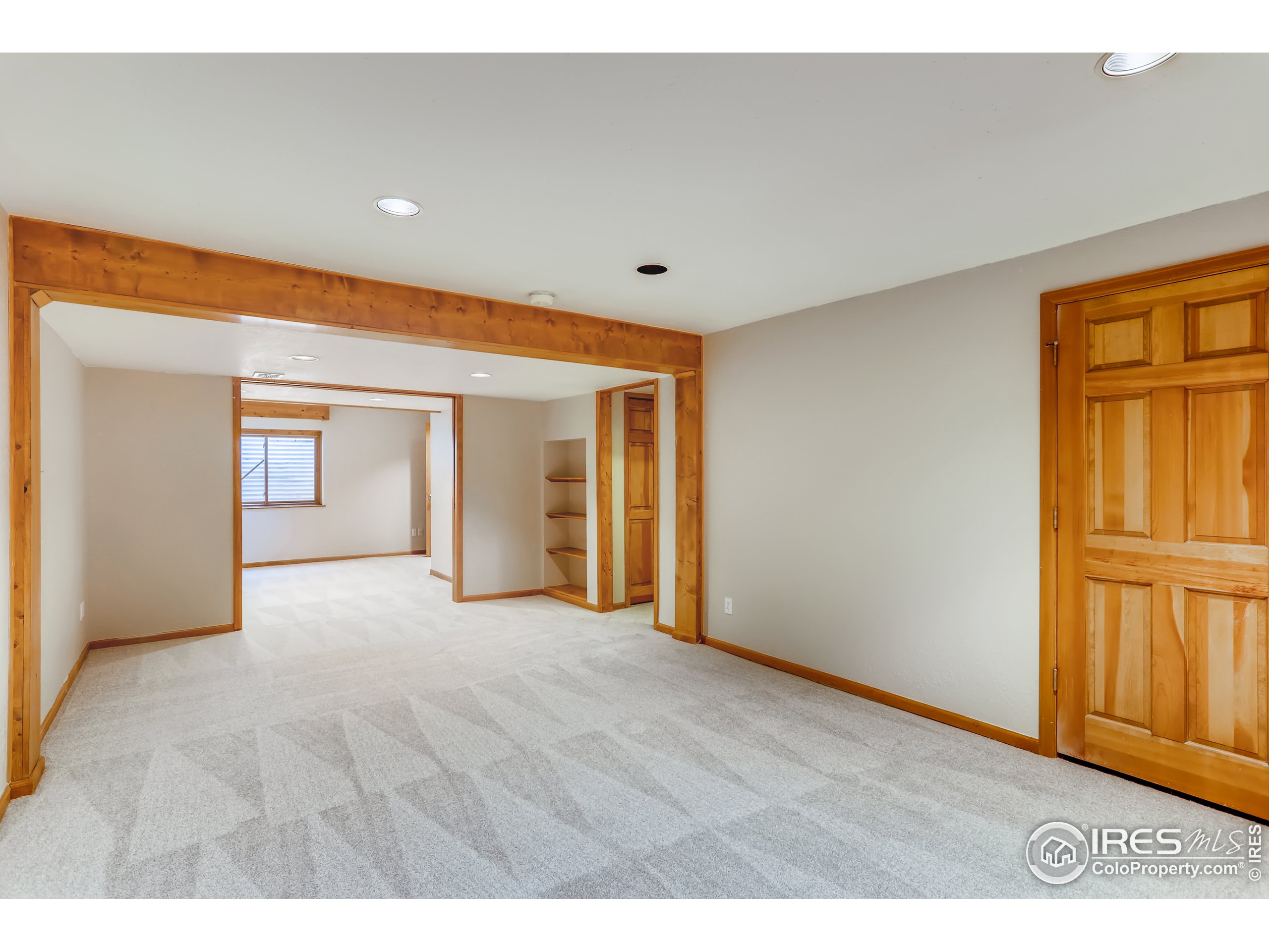 2315 Ranch Drive Westminster, CO 80234 - Photo 22 of 28 a view of an empty room with window and kitchen view